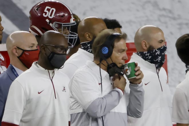 Nick Saban (center) 