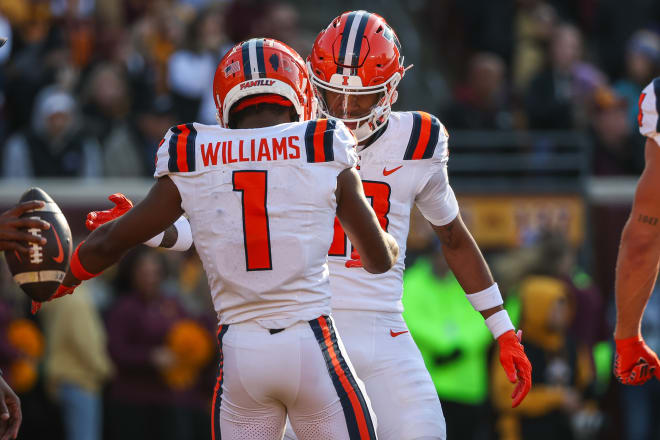 Nov 4, 2023; Minneapolis, Minnesota, USA; Illinois Fighting Illini wide receiver Isaiah Williams (1) celebrates his touchdown with wide receiver Pat Bryant (13) during the first half against the Minnesota Golden Gophers at Huntington Bank Stadium. Mandatory Credit: Matt Krohn-USA TODAY Sports