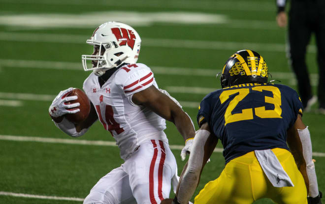 Michigan Wolverines football LB Michael Barrett tries to make a tackle