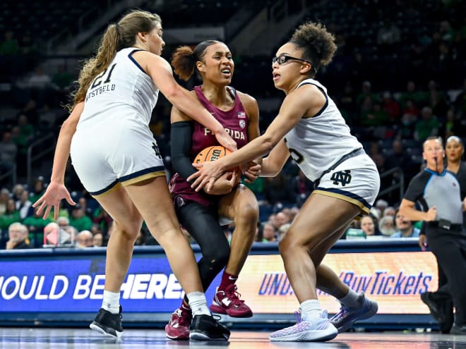 Notre Dame guard Olivia Miles, right, fouls Florida State guard Sara Bejedi with Maddy Westbeld also playing tight defense.