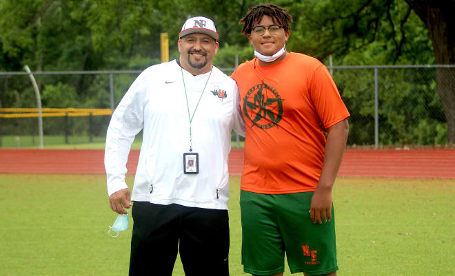 Texas offensive lineman Markis Deal holds a Michigan Wolverines football recruiting offer. 