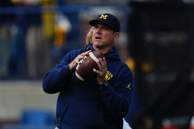 Michigan Wolverines football coach Jim Harbaugh and U-M face Washington tonight.