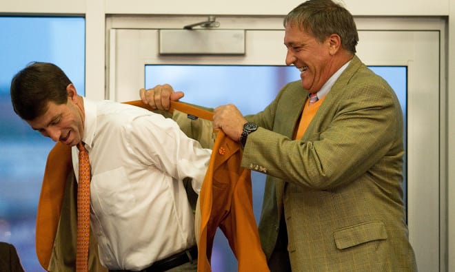 Bill D'Andrea is shown here in December of 2008 fitting Dabo Swinney with an orange jacket as Swinney is formally announced as Clemson's next head football coach.