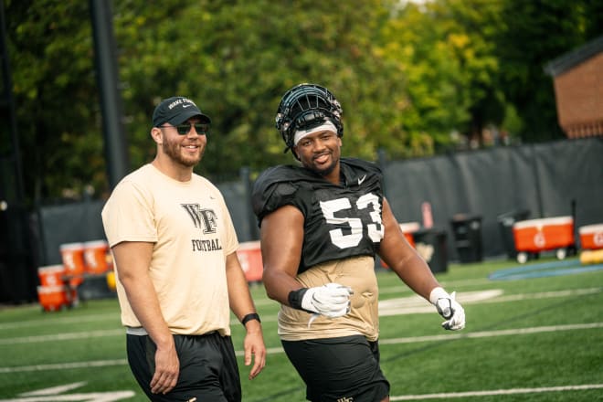 Michael Jurgens, left, and Je'Vionte' Nash walk together on Wake Forest's practice field during the first week of fall camp. 
