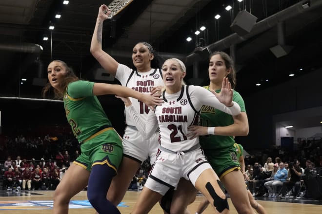 South Carolina center Kamilla Cardoso calls for the ball as Notre Dame's Kylee Watson (left) and Sonia Citron defend.