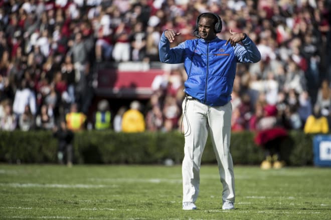 Florida head coach Randy Shannon communicates with players during the first half of an NCAA college football game against South Carolina on Saturday, Nov. 11, 2017, in Columbia, S.C. South Carolina defeated Florida 28-20.
