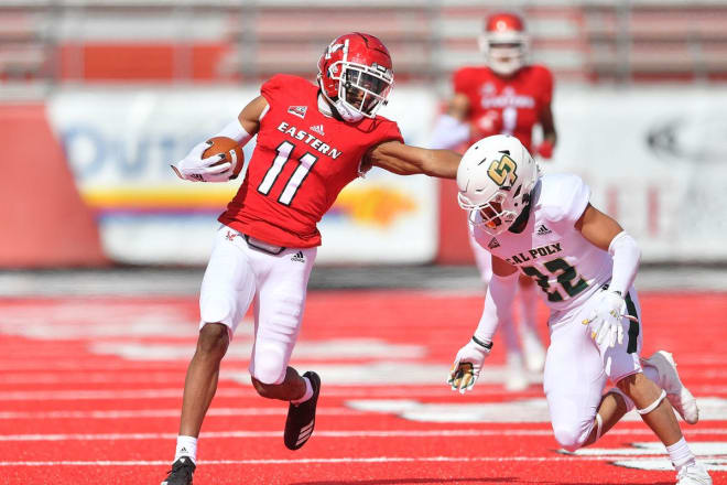 Eastern Washington wide receiver Freddie Roberson attempts to elude the tackle of Cal Poly defensive back Xavier Oliphant on Saturday at Roos Field in Cheney, WA..