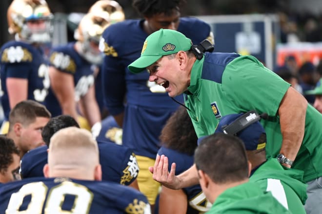 Notre Dame defensive coordinator fires up his defense on the sideline during ND's 42-3 season-opening rout of Navy on Saturday.