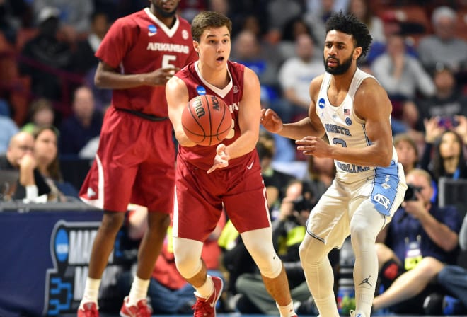 Former Hog Dusty Hannahs is guarded by North Carolina's Joel Berry II in the second round of the 2017 NCAA Tournament.