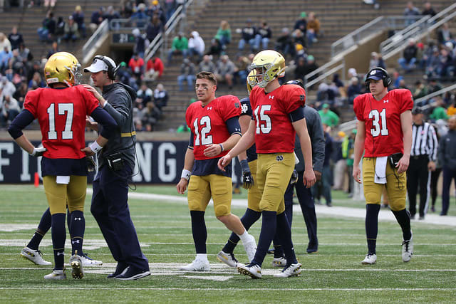 Quarterbacks Ian Book (No. 12) and Phil Jurkovec (No. 15) when they were both at Notre Dame