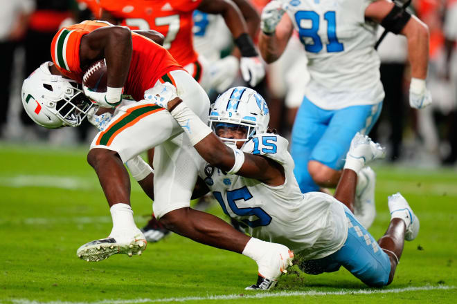 UNC's Ladaeson DeAndre Hollins, right, pulls down Miami's Key'Shawn Smith during last weekend's game. 