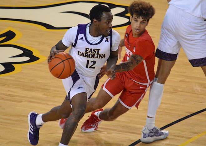 ECU guard Tremont Robinson-White drives on Radford's Quinton Morton-Robertson in Saturday's win over Radford