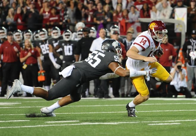 Derek Moore tackles USC QB Sam Darnold during Friday night's 30-27 win.  
