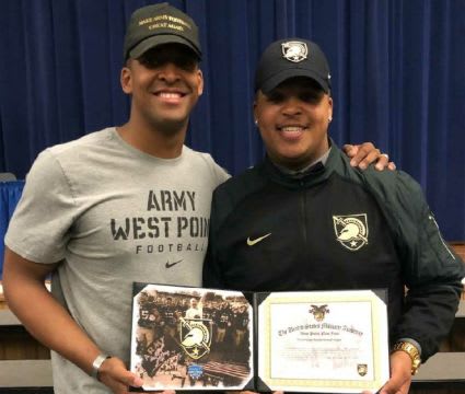 Former Army TE Kelvin White joins in with younger brother Tim Kater during signing ceremony