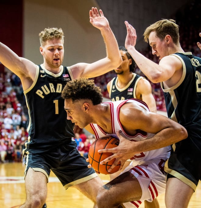 Indiana's Trayce Jackson-Davis (23) is swarmed by the Purdue defense during the first half of the Indiana versus Purdue men's basketball game at Simon Skjodt Assembly Hall on Saturday, Feb. 4, 2023. 