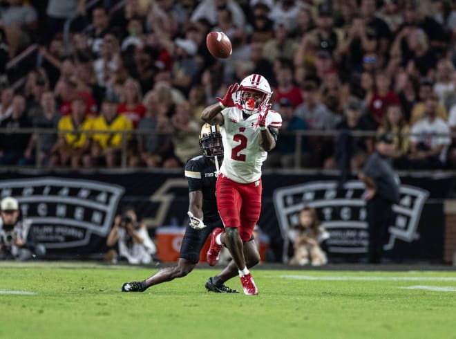 Wisconsin cornerback Ricardo Hallman lurks a pass from Purdue's Hudson Card. 