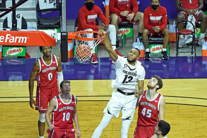 Buffs senior center Dallas Walton dunks the ball in the first half of Colorado's 84-61 win over South Dakota 