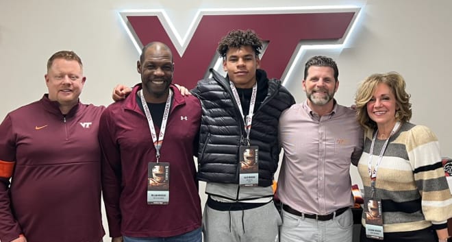Woodson with his parents, Hokies LB/Nickel coach Shawn Quinn, and Brent Pry