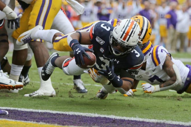 D.J. Williams dives for the end zone while playing for Auburn.