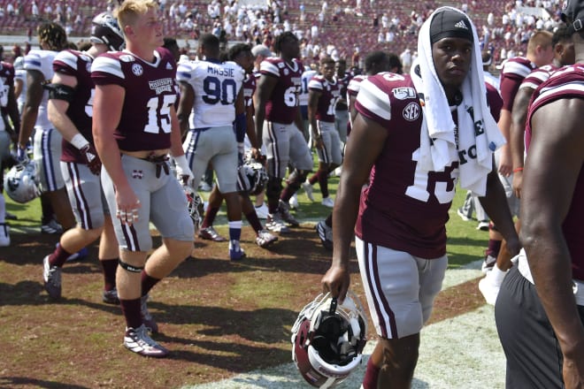 Mississippi State players retreat to their fractured locker room following a loss to Kansas State. 