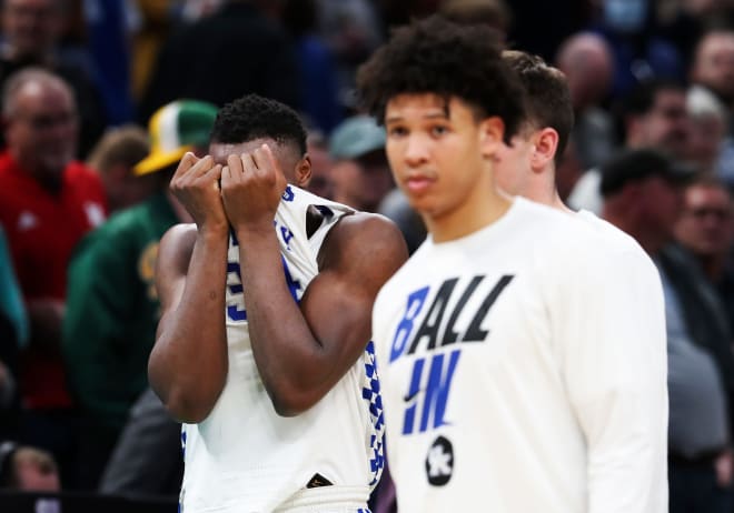 UK's Oscar Tshiebwe (34), left, was distraught after they lost their first round NCAA Tournament game against Saint Peter's at the Gainbridge Fieldhouse in Indianapolis, In.  on Mar.  17, 2022.