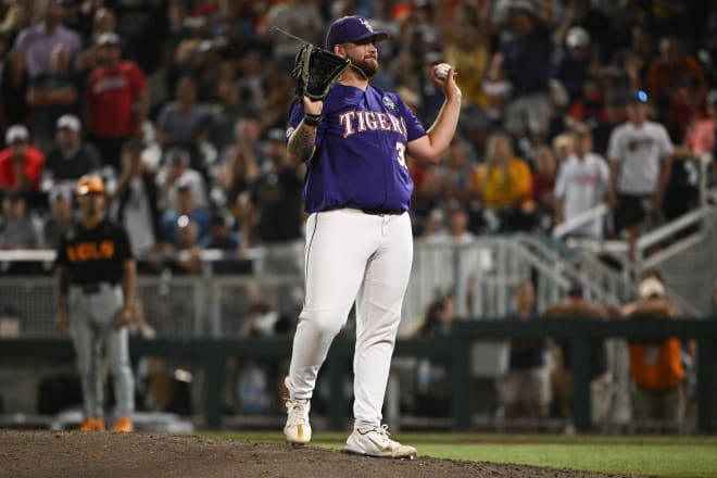 LSU reliever Riley Cooper shows the game-ending third-out line-drive he caught in the Tigers' 6-3 College World Series opening win over Tennessee Saturday night in Omaha.