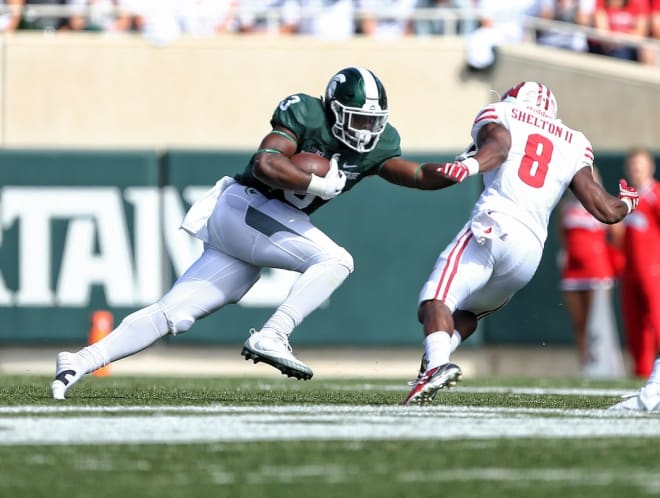 Michigan State running back LJ Scott (No. 3) leads the Spartans in rushing yards. 