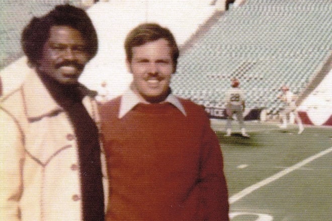 Gene "Blue" Robbins poses with James Brown, The Godfather of Soul, during Georgia's walk-through practice for the 1976 Cotton Bowl.