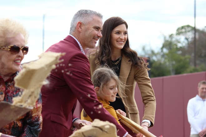 Mike, Maria and their daughter, Mila, at the groundbreaking event for the football only building in December.