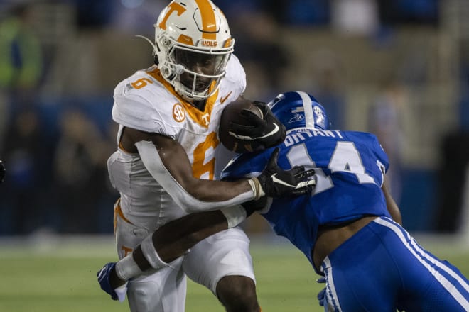 Tennessee running back Dylan Sampson (6) runs against Kentucky defensive back Ty Bryant (14) during the second half of an NCAA college football game in Lexington, Ky., Saturday, Oct. 28, 2023. (AP Photo/Michelle Haas Hutchins)