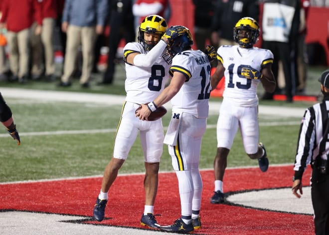 Receiver Ronnie Bell congratulates Cade McNamara for finding the end zone against Rutgers.