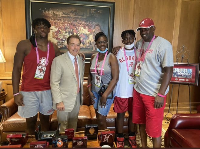 Kelby Collins (left) with Coach Saban and his family on Saturday in Tuscaloosa.