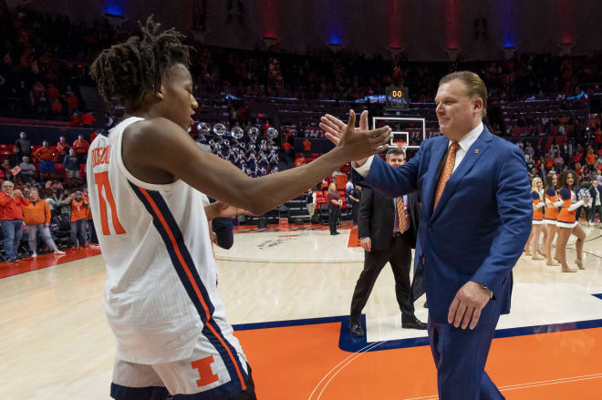 Illinois Fighting Illini guard Ayo Dosunmu celebrates with head coach Brad Underwood after a game against the Iowa Hawkeyes at State Farm Center.