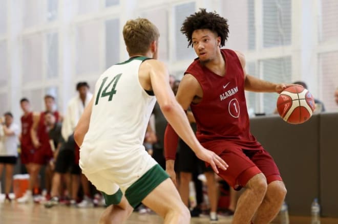 Mark Sears running the point during one of the Alabama overseas exhibition games