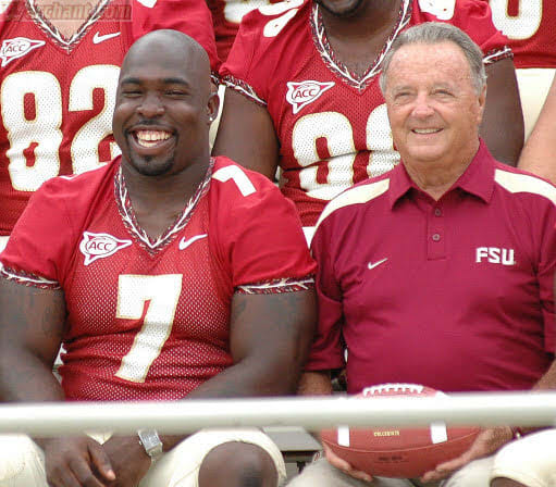 Bobby Bowden shares a laugh with linebacker Buster Davis during a team photo shoot in the mid-2000s.
