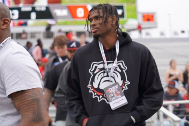 Class of 2023 five-star edge defender Jayden Wayne makes his way to the field for G-Day warmups.