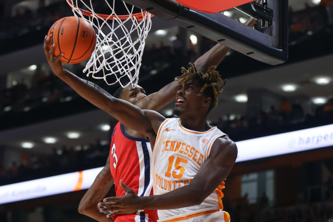 Jan 6, 2024; Knoxville, Tennessee, USA; Tennessee Volunteers guard Jahmai Mashack (15) goes to the basket against Mississippi Rebels forward Jamarion Sharp (3) during the first half at Thompson-Boling Arena at Food City Center.