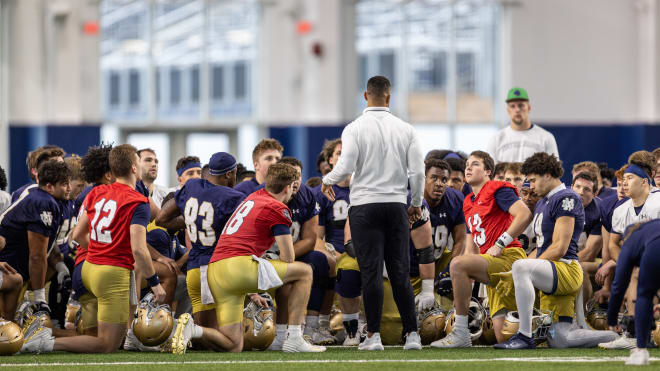 Notre Dame head coach Marcus Freeman addressed his team between stretching and position drills Thursday at the Irish Athletic Center.