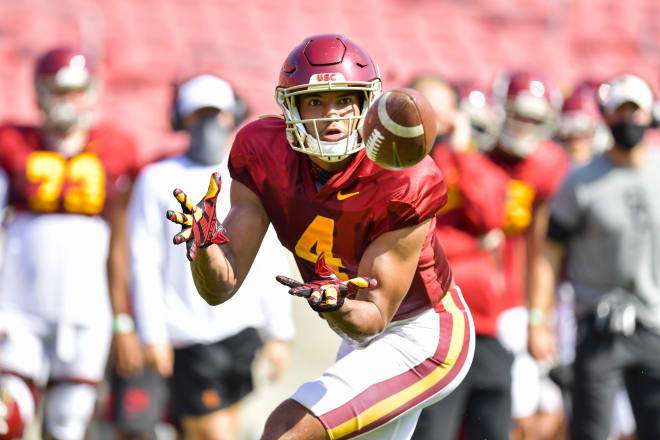 Redshirt freshman Bru McCoy looks in a reception during USC's first preseason scrimmage Saturday.