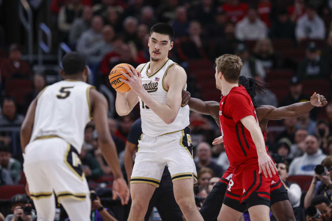 Mar 10, 2023; Chicago, IL, USA; Purdue Boilermakers center Zach Edey (15) looks to pass the ball away from Rutgers Scarlet Knights center Clifford Omoruyi (11) during the first half at United Center. Mandatory Credit: Kamil Krzaczynski-USA TODAY Sports