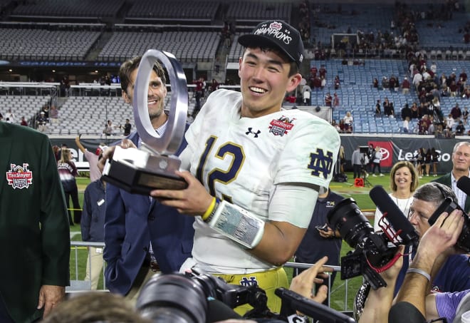 Irish QB Tyler Buchner poses with his Gator Bowl MVP Trophy, Friday in Jacksonville, Fla.