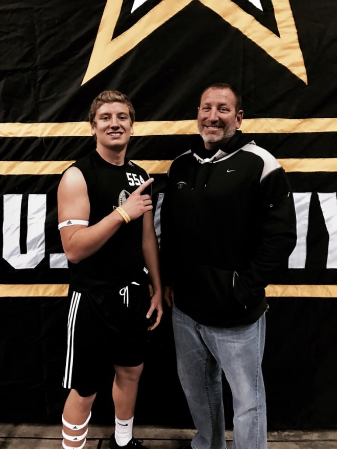 Brayden Flynn with his dad at the US Army All America Combine