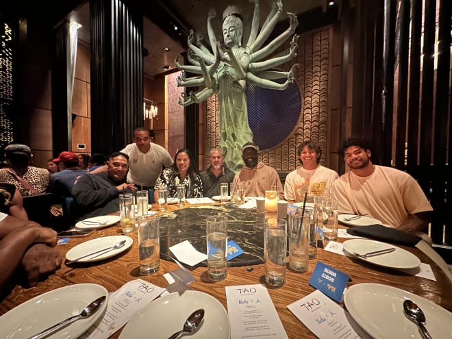 Cyrus Polu, a 2025 outside linebacker, took an official visit to UCLA from Monday to Wednesday that included dinner at the Tao Los Angeles restaurant. Among the coaches pictured include head coach DeShaun Foster (middle), defensive coordinator Ikaika Malloe (far left) and defensive analyst Scott White (standing).