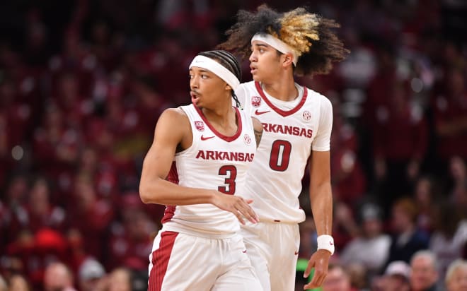 Arkansas freshmen Nick Smith Jr. (No. 3) and Anthony Black (No. 0) during a win over UNC Greensboro. 