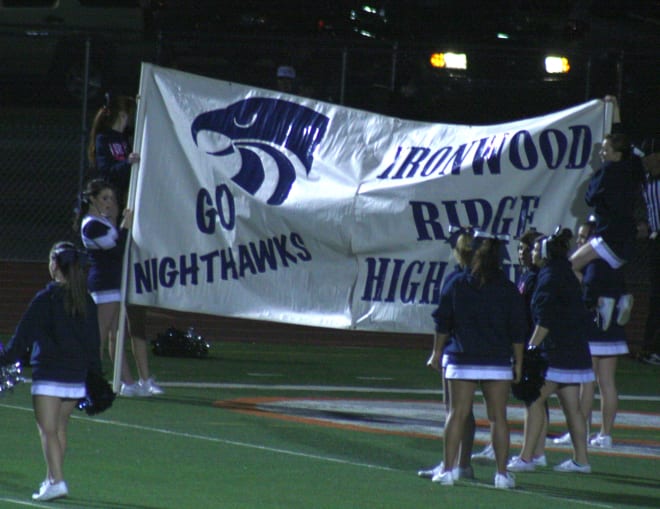 The Ironwood Ridge cheerleaders get a banner ready for the team to run through during a road game.  The Nighthawks will take two trips to the Valley during the 2019 season.  IRHS goes to Millennium (in Goodyear) on Sept. 6 and defending champion Centennial (in Peoria) on Sept. 20.