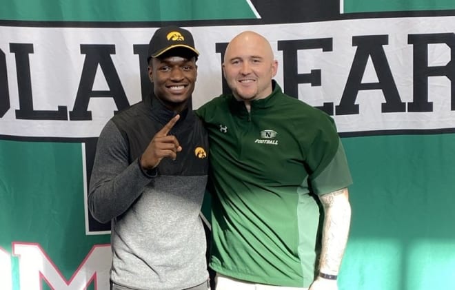 Deavin Hilson with Des Moines North head coach Eric Addy on National Signing Day.