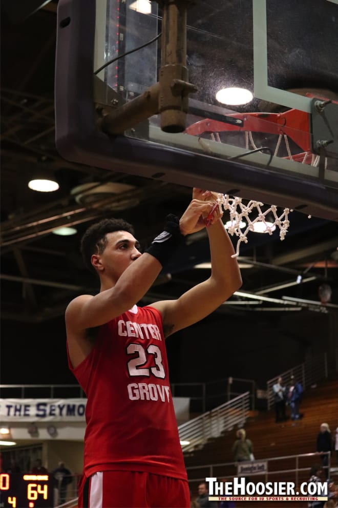 Indiana signee Trayce Jackson-Davis cuts down a piece of the net after winning a regional title.