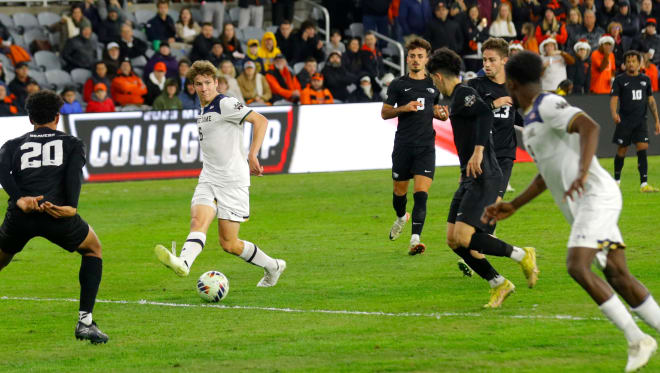 Notre Dame's Wyatt Lewis passes the ball to Eno Nto, who scoreed the game-winning goal against Oregon State in the College Cup on Friday night.