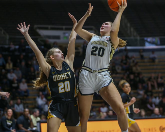 Purdue Boilermakers guard Mary Ashley Stevenson (20) attempts to shot a basket over Quincy Hawks guard Mariann Blass (20) during the NCAA women's basketball game against the Quincy Hawks, on Sunday, Oct. 29, 2023, at Mackey Arena in West Lafayette, Ind. Purdue won 106 - 45.
