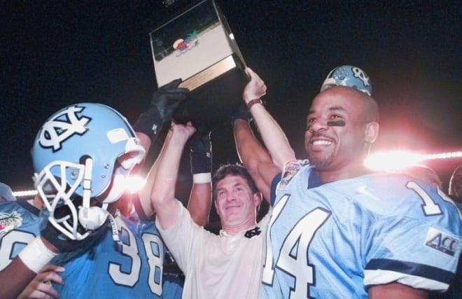 Mack Brown and the Tar Heels celebrating their 1995 Carquest Bowl win was one of many postseason appearances.